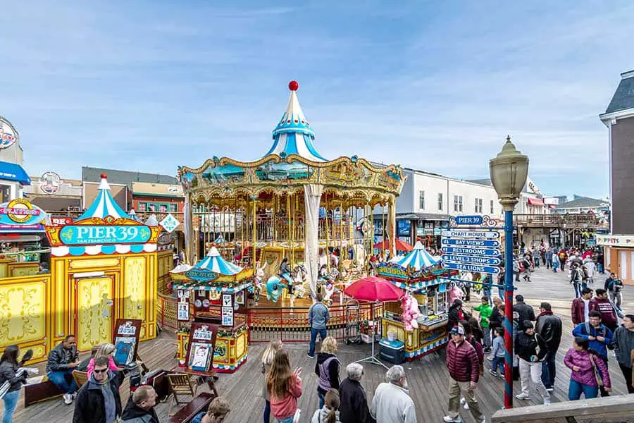 Tourists at Fisherman's Wharf, Pier 39 carousel.