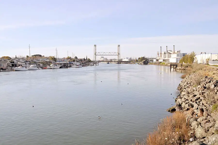 Water with boats and buildings along edge