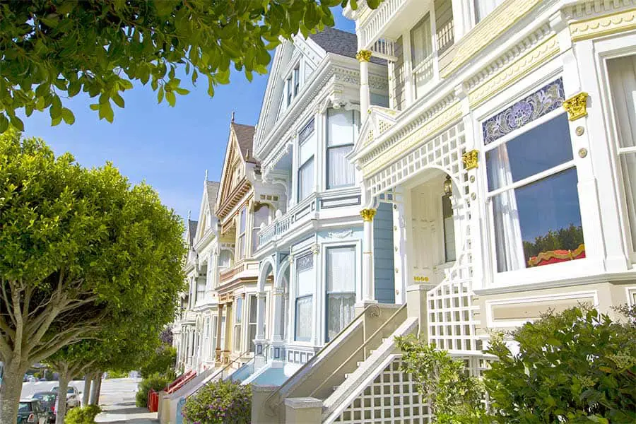 Looking at colorful houses from sidewalk