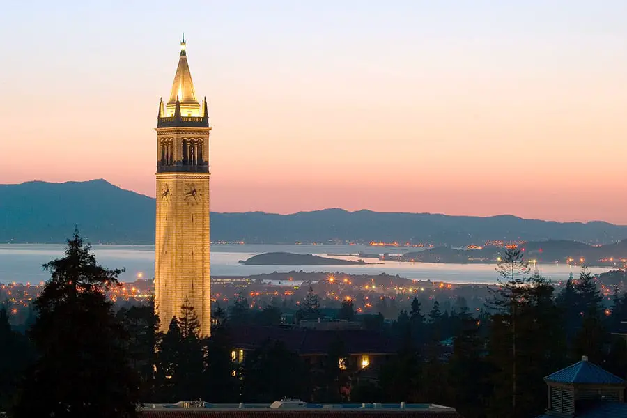 Sather Tower with mountains in background