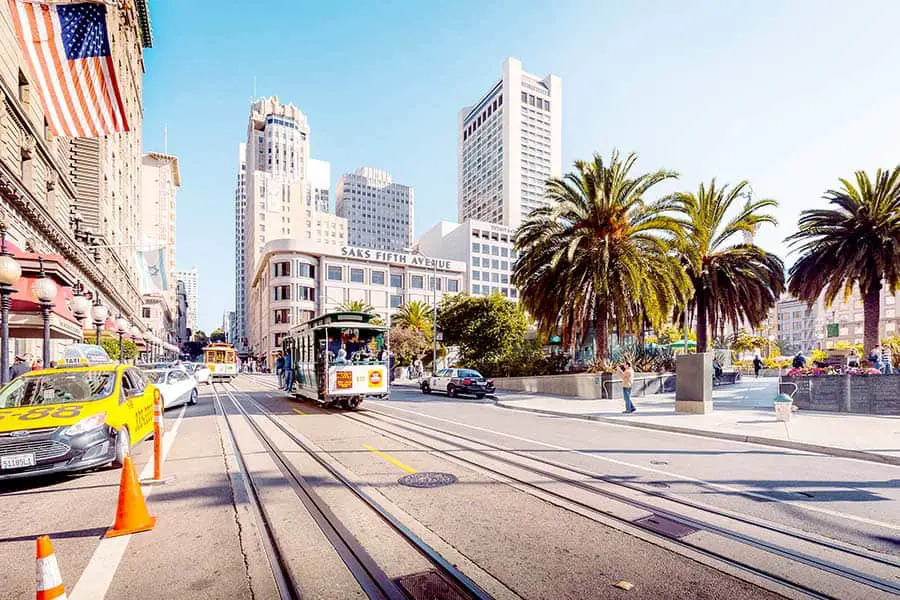 Cable car going down middle of street