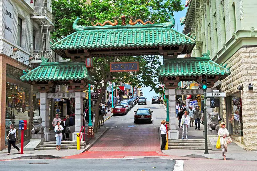 People in Chinatown with Dragons Gate in foreground