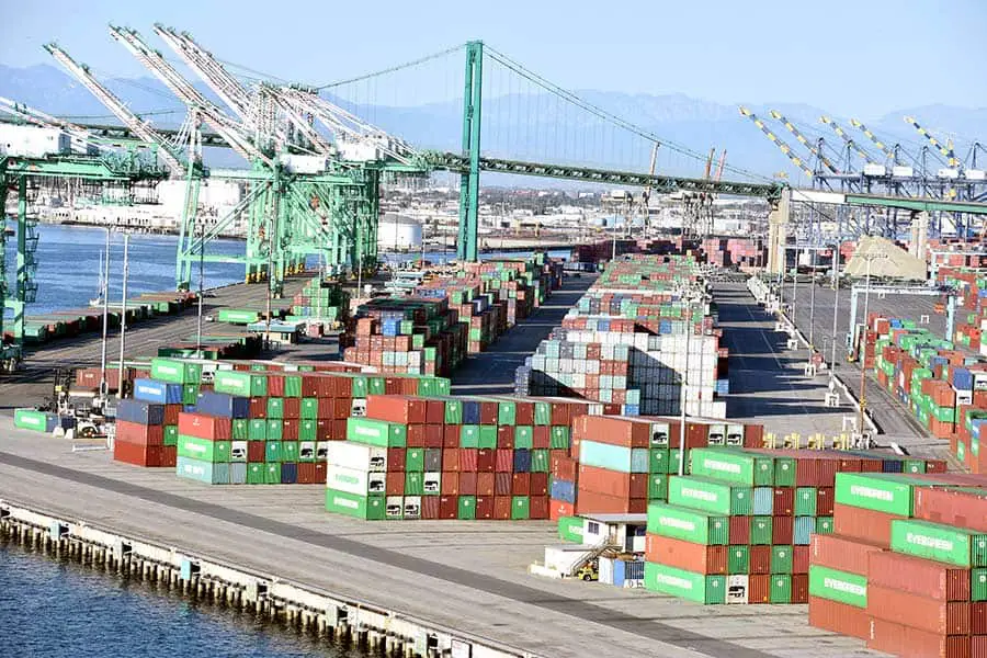 Busy port with cargo containers and cranes