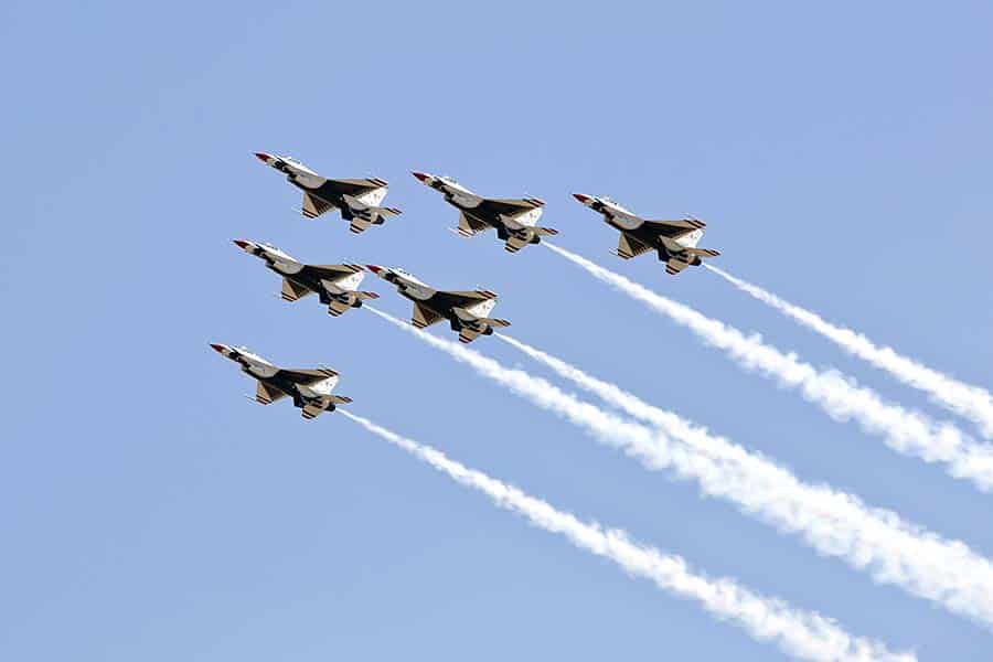 Air Force Thunderbirds flying across a blue sky