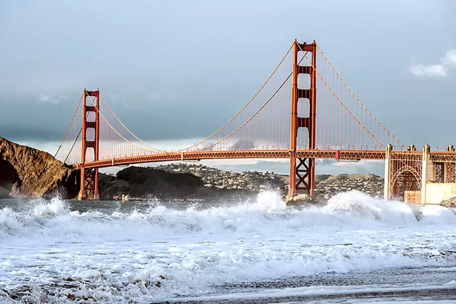 Storm churns waves in San Francisco Bay, Golden Gate Bridge in background