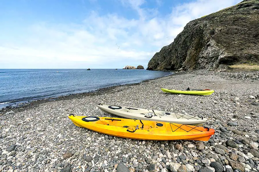 Three kayaks on beach at Stoney Beach Cove